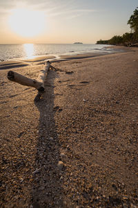 Scenic view of beach against sky during sunset