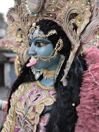 Close-up of durga statue on road in city