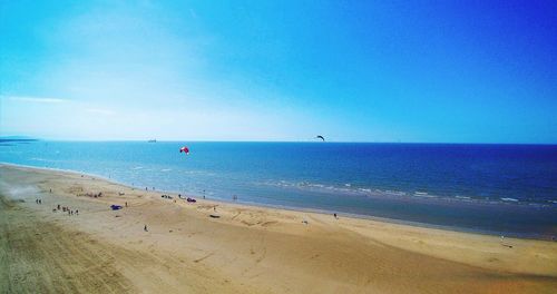 Scenic view of sea against clear blue sky