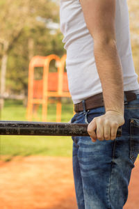 Rear view of man holding umbrella