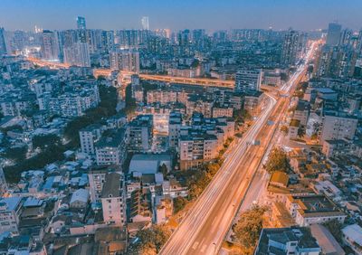 High angle view of illuminated cityscape against sky