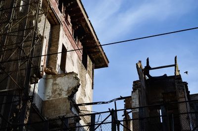 Low angle view of old building against sky