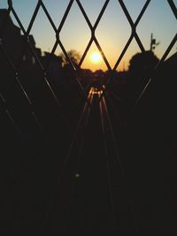 Chainlink fence at sunset