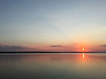 Scenic view of sea at sunset