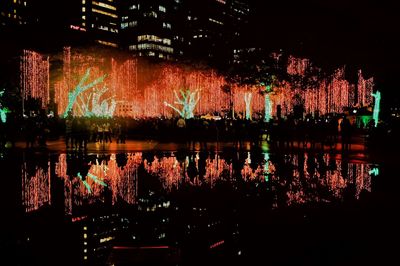 Reflection of illuminated sky on water at night