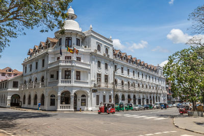 Facade of historic building against sky