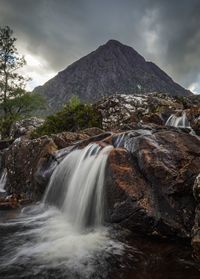 Scenic view of waterfall in forest