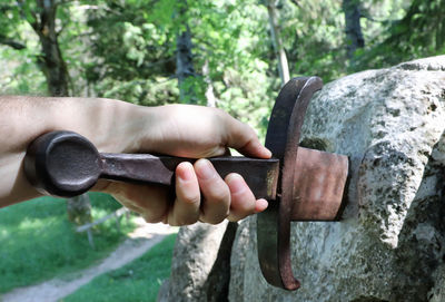 Close-up of hand holding rock