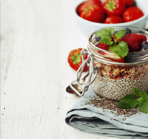 Close-up of fruits in jar on table