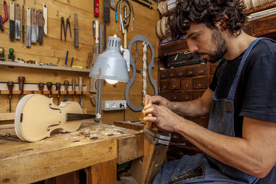 Craftsman violinmaker began working on a new violin in his workshop