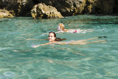 Portrait of woman swimming in pool