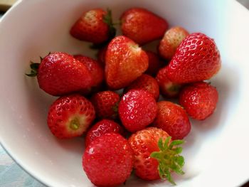 High angle view of strawberries in bowl on table