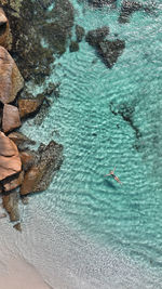 Woman swimming in sea at beach