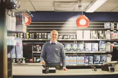 Portrait of man standing in store