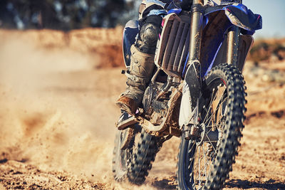 Low section of man riding motorcycle