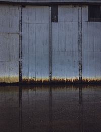 Full frame shot of metallic structure by lake