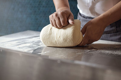 Midsection of man preparing food on table