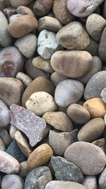 Full frame shot of pebbles at beach