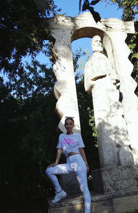 Low angle view of statue against trees