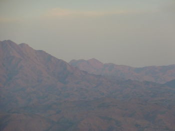 Scenic view of mountains against sky during sunset