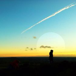 Scenic view of landscape at sunset