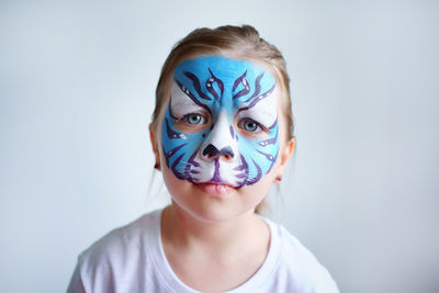 Girl aqua makeup in the form of a blue water tiger zodiac, symbol new year 2022, sad portrait.