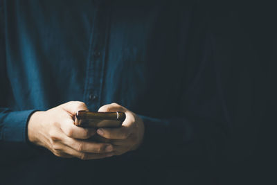 Social media technology concept, men's hands using smartphones to login social media, work from home 