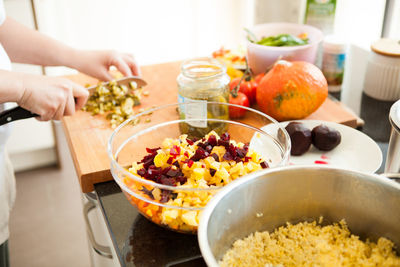 Midsection of person preparing food on table