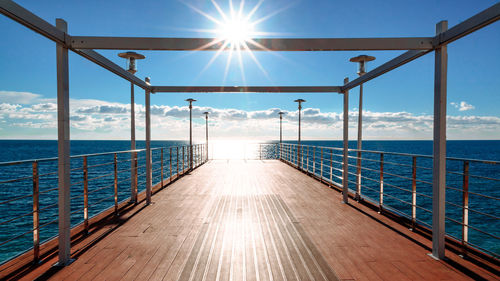 Gorgeous view from the pier or deck to the sea horizon of the turquoise sea on a sunny summer day