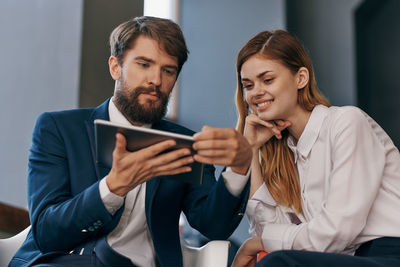 Business people using digital tablet at office