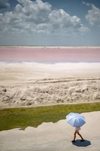 Scenic view of pink beach against sky
