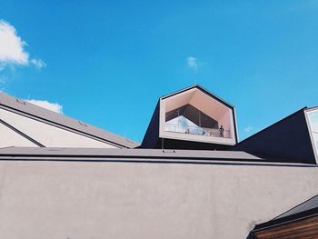 Low angle view of building against blue sky