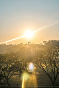 Scenic view of silhouette trees against sky during sunset