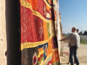 Rear view of man painting on wall