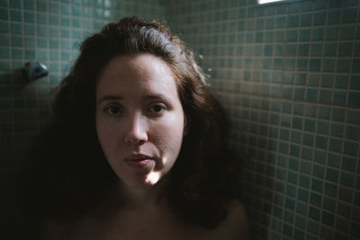 Portrait of young woman in bathroom
