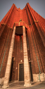 Low angle view of red building against sky