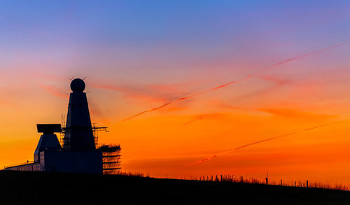 Scenic view of silhouette land against sky during sunset