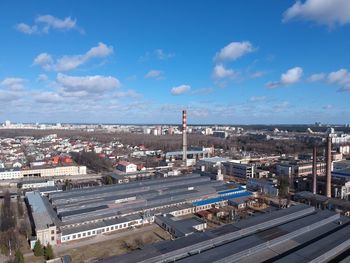 High angle view of road by buildings against sky