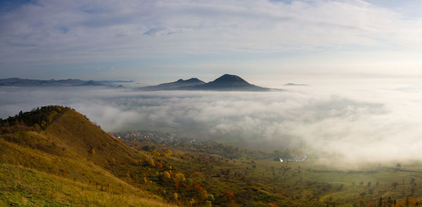 Scenic view of landscape and mountains against sky