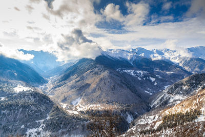 Scenic view of mountains against sky during winter