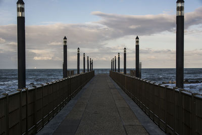 Pier over sea against sky