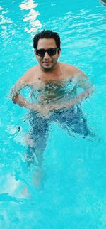 High angle view of man swimming in pool