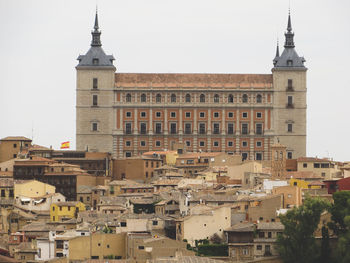 View of buildings in city against sky