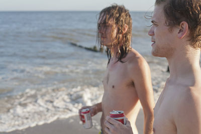 Young men hanging out on a beach