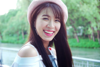 Portrait of happy young woman outdoors