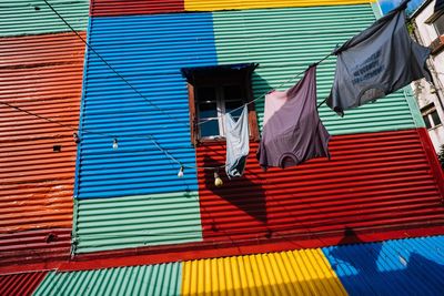 Low angle view of clothes drying against building