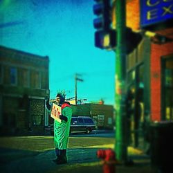 Man standing on railroad station platform