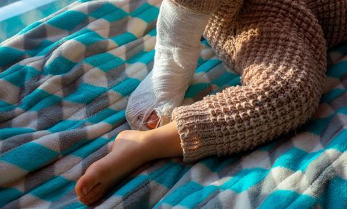 Child with bandage on leg heel fracture. broken right foot, splint of toddler. 