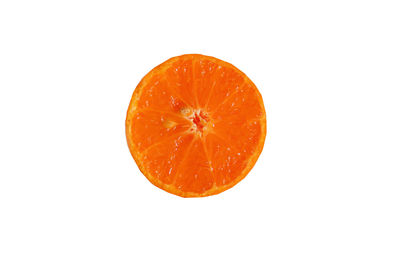 Close-up of orange slice against white background