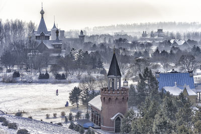 Buildings against sky during winter